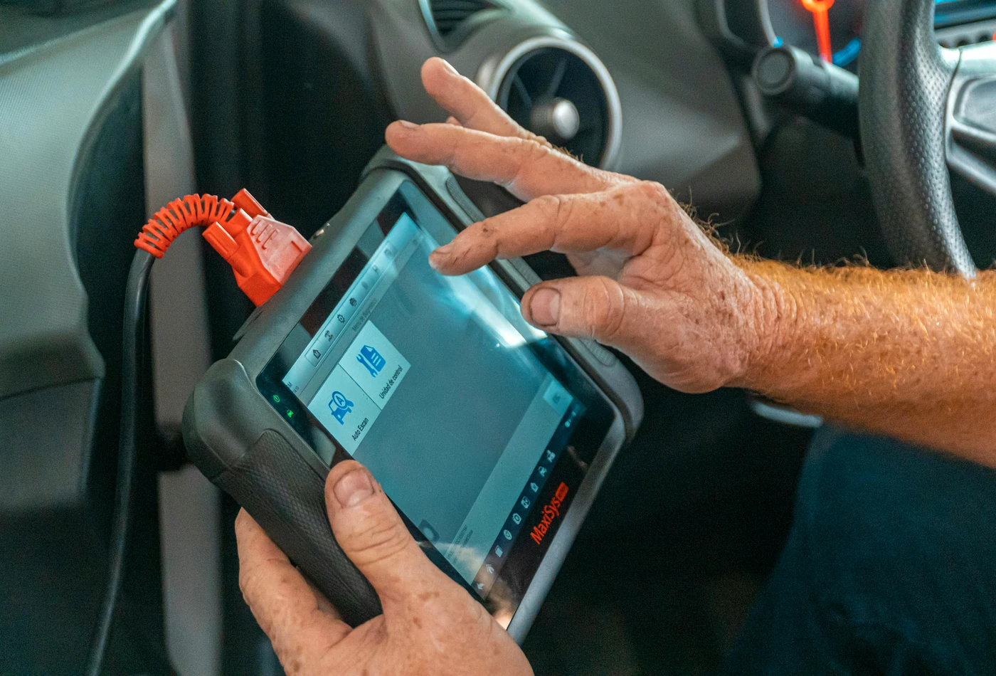 Professional vehicle diagnostics inside a car